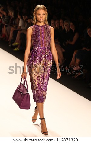 NEW YORK - SEPTEMBER 12:A model walks the runway at the J.MENDEL Spring/Summer 2013 collection Mercedes-Benz Fashion Week in New York on September 12,2012