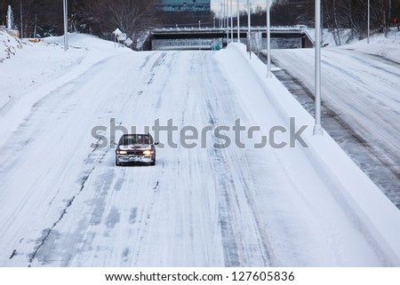 NORWALK,CT - FEBRUARY 09:  Car on I-95 after winter storm in Norwalk on February 09,2013