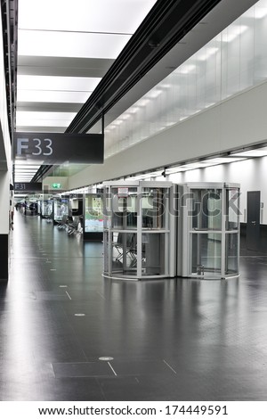 VIENNA-JANUARY 03: Vienna airport  with smokers cabin for travelers inside airport hall in Austria on January 03, 2013.