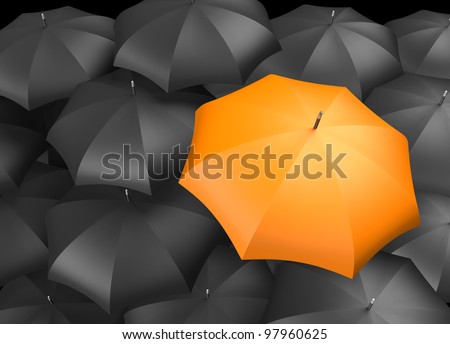 Orange umbrella standing out from background of black umbrellas