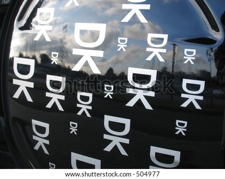 The registration letters of Denmark... DK ... but also small men. Seen at the rear side of a black car.