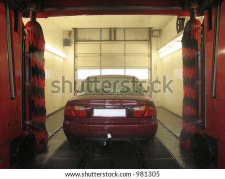 Mazda 323 in carwash. architecture