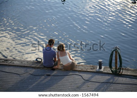 Young couple in love - dreaming of going away?