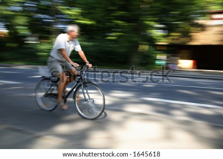 Young Danish male in full speed on his bike.
