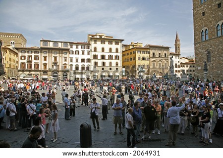 Piazza della Signoria Florence - Tuscany - Italy with Palazzo Vecchio on the right. The square is crowded with tourists.