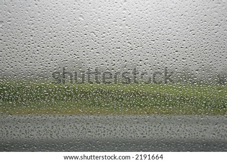 It is raining outside - seen from inside a car.