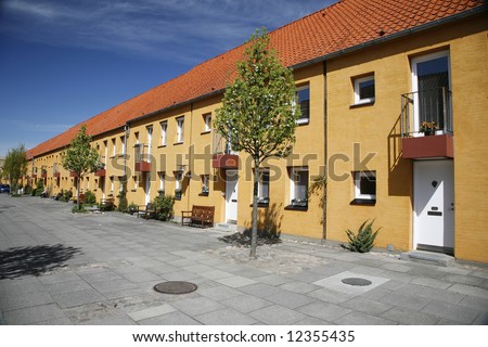 stock-photo-urban-row-house-in-pedestrian-street-denmark-12355435.jpg