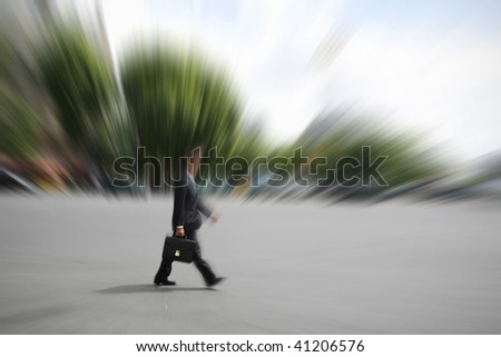 Businessman hurrying on his way to an appointment in city. Space for text.