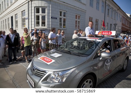 NYBORG, DENMARK - AUGUST 7: Tour director Jesper Worre in his car in front of the riders at the start of stage four of Tour of Denmark August 7, 2010 Nyborg, Denmark.