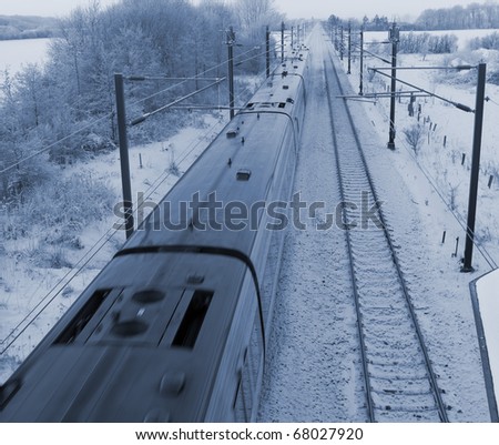 Danish intercity train on a cold December day in the countryside.