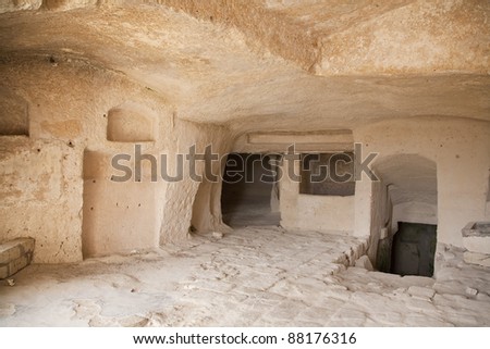 Interior of a cavern in ancient town of Matera - Sassi . It is one of the first human settlements in Italy. The Sassi are houses dug into the calcareous rock itself. Basilicata - Italy.