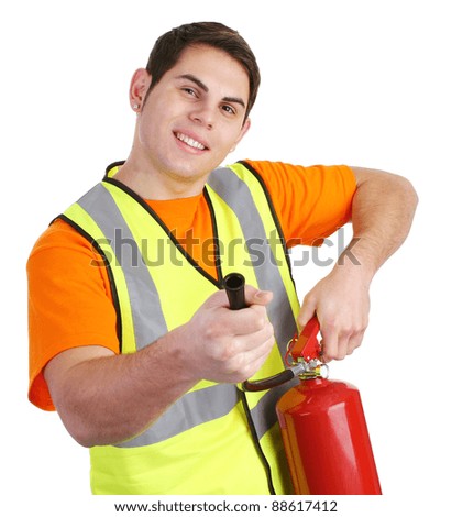 A guy wearing a hiviz jacket and holding a fire extinguisher