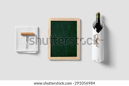 Drawing board and bottle of wine in kitchen