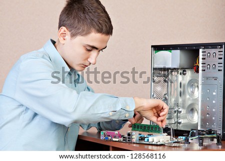 Technician repairing computer hardware in the lab.  Studio shot. Small DOF