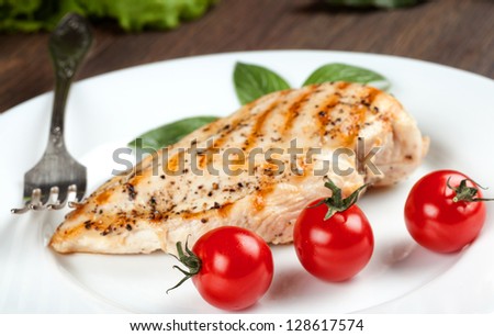 Grilled chicken breast with fresh cherry tomatoes