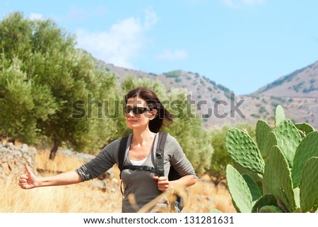 Travel woman hitchhiking. Greece. Crete.
