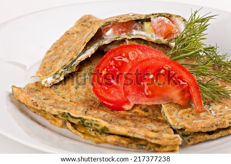 Zucchini pancakes, stuffed  vegetables and red fish