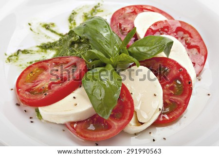 Caprese - italian salad with mozzarella cheese, tomato and basil.