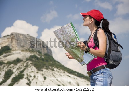 woman with the binoculars in the mountains