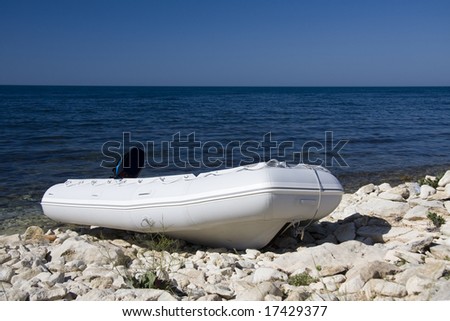 inflatable boat on the sea coast