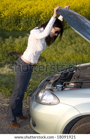 women looking into broken engine