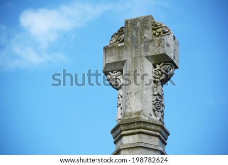 Detail of stone cross war memorial outside Winchester Cathedral, England