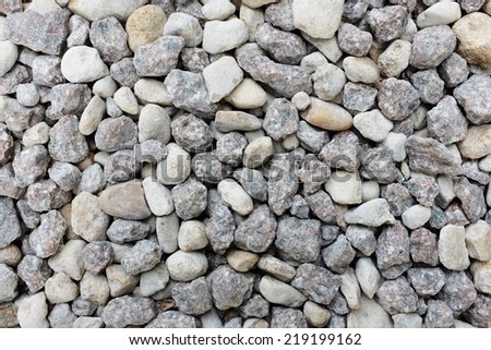 Grey and white crushed granite rock as an abstract texture background