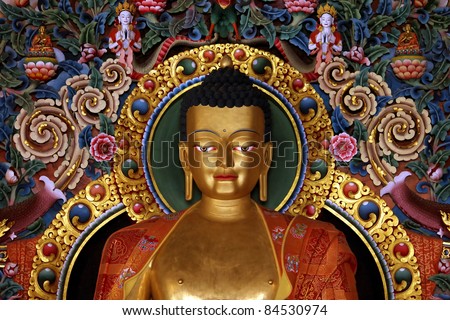 gilded metal statue of preaching Buddha in a Tibetan Buddhist monastery in , Chandragiri, Orissa,India