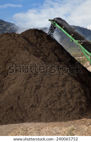 Photo of large amount of compost being produced.