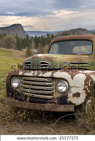 outdoor photo of rusting old pick-up truck.