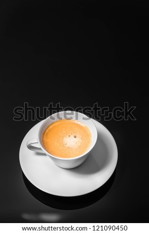 Black Coffee poured into stylish modern white coffee cup, selective focus, isolated background