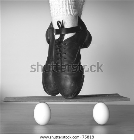 Irish Dancer balanced on board held up by eggs