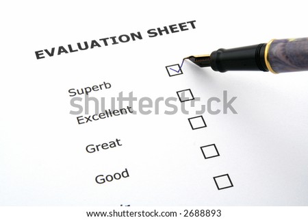 evaluation sheet with a pen and a box ticked