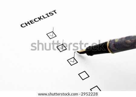 checklist with three boxes ticked and a pen
