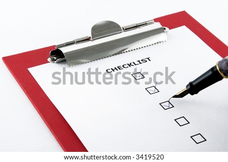 checklist and pen on clipboard, white background