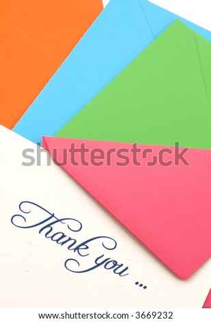 thank you note and four colored envelopes isolated on white