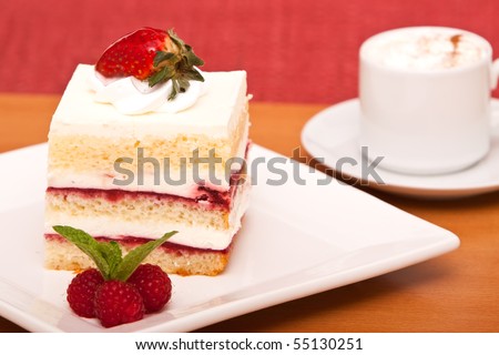 Strawberry or raspberry cake with cappucino