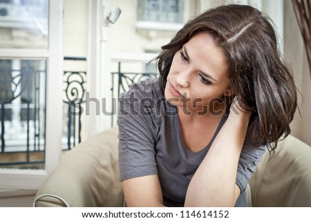 Portrait of a beautiful woman thinking and looking worried