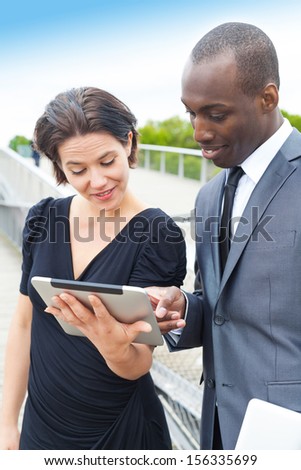 Handsome businessman presenting the project to her collaborator or client
