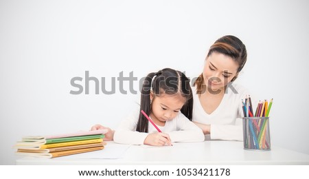Portrait of mother and daughter learning to write, mother teaching little girl homework isolated on white background, Education study home school mother\'??s day concept banner