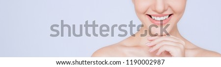 Portrait of attractive caucasian woman with beautiful teeth and skin isolated on white, close up young beautiful face smiling girl with her hand touching her chin. Healthy teeth dental care concept