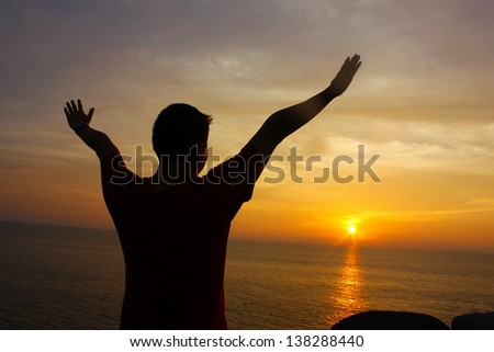 Silhouette Image of Man Raising His Hands