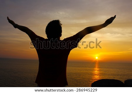 Silhouette Image of Man Raising His Hands