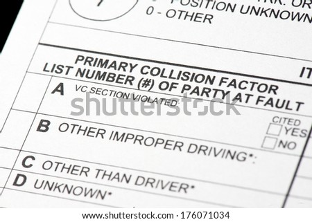 A close up view of a traffic collision report form.