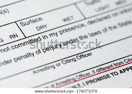 A close up of a traffic ticket.
