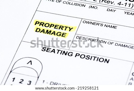 A close up of a police report listing property damage