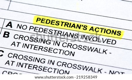 A close up of a police report listing pedestrians