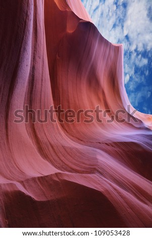 Stone of the jet and the cloudy sky. The Magic Antelope Canyon in the Navajo Reservation, the United States