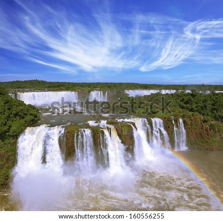 The best-known falls in the world - Iguazu. The magnificent rainbow costs over roaring water streams.