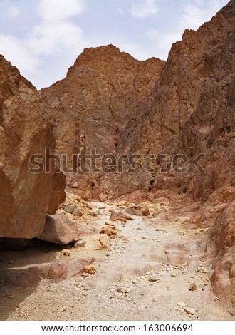Tourist walk on a picturesque route in stone desert. Red sea, Israel